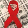 red AIDS ribbon and 100 dollar bills