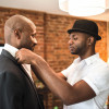 two black gay men getting dressed