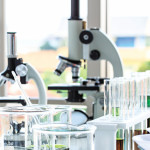 beakers and microscopes in laboratory