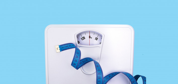 scale and blue tape measure weight