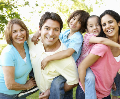 A multi-generational latin family having fun outdoors