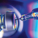 needle going into vial vaccine