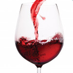 red wine pouring into glass